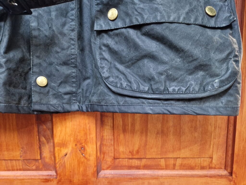 The bottom edge of the Barbour International has been repaired! What a result!