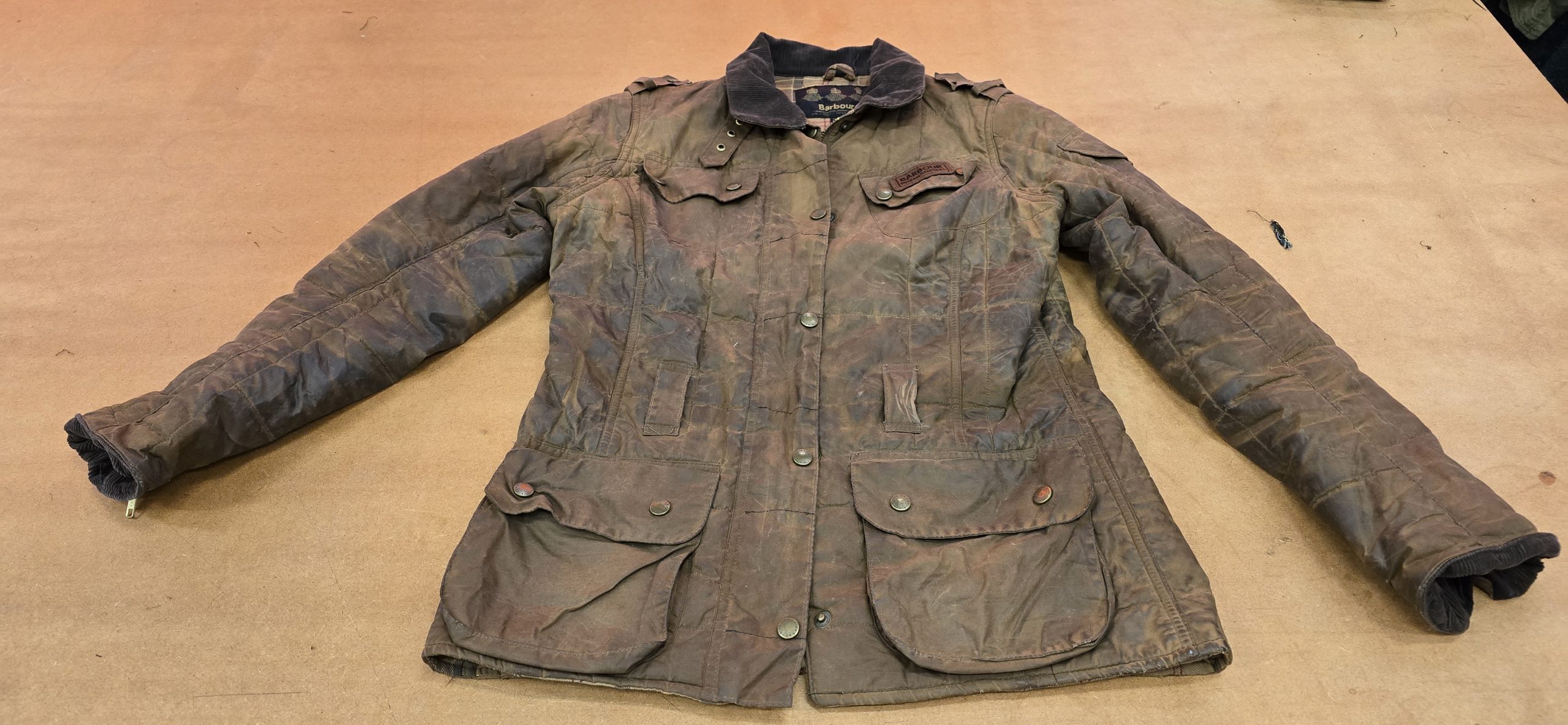 Waxed cotton jacket after specialist cleaning and restoration