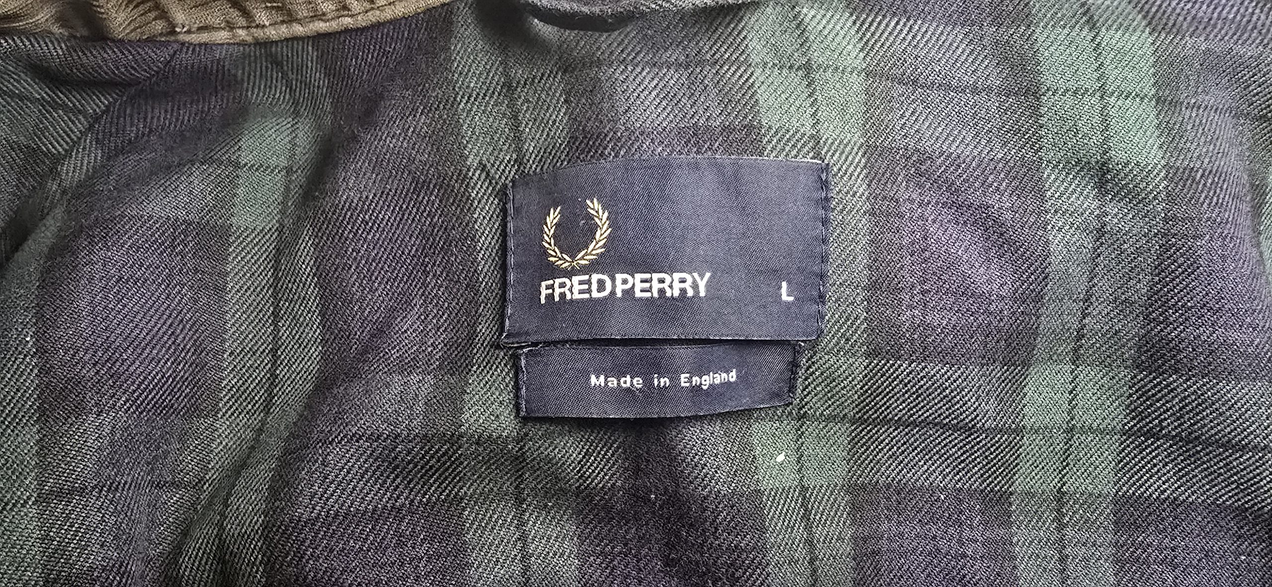 Fred Perry Made in England jacket label photographed by Wax Jackets Cleaned