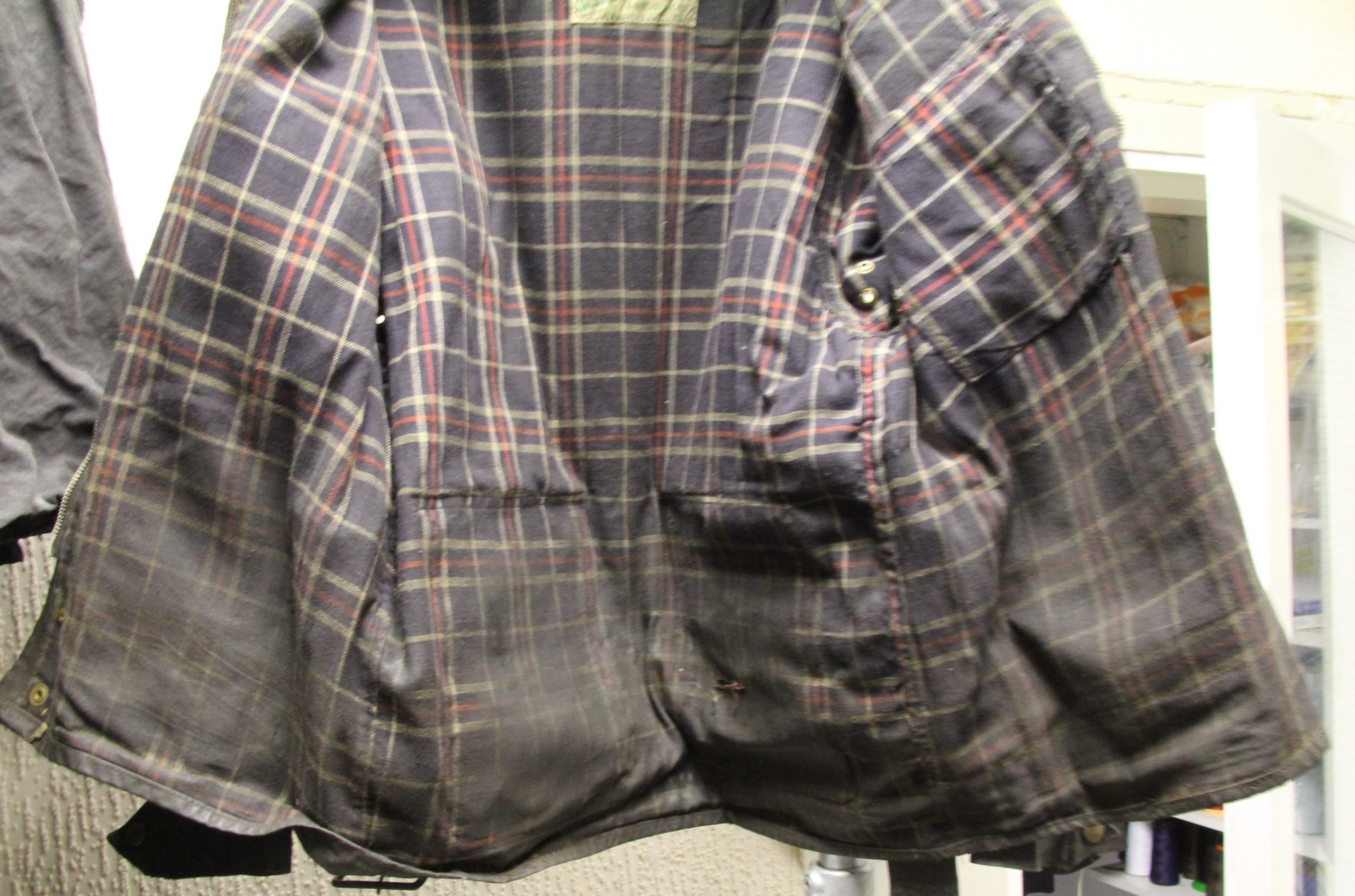 Dirty and heavily worn Barbour jacket before specialist cleaning and re-waxing