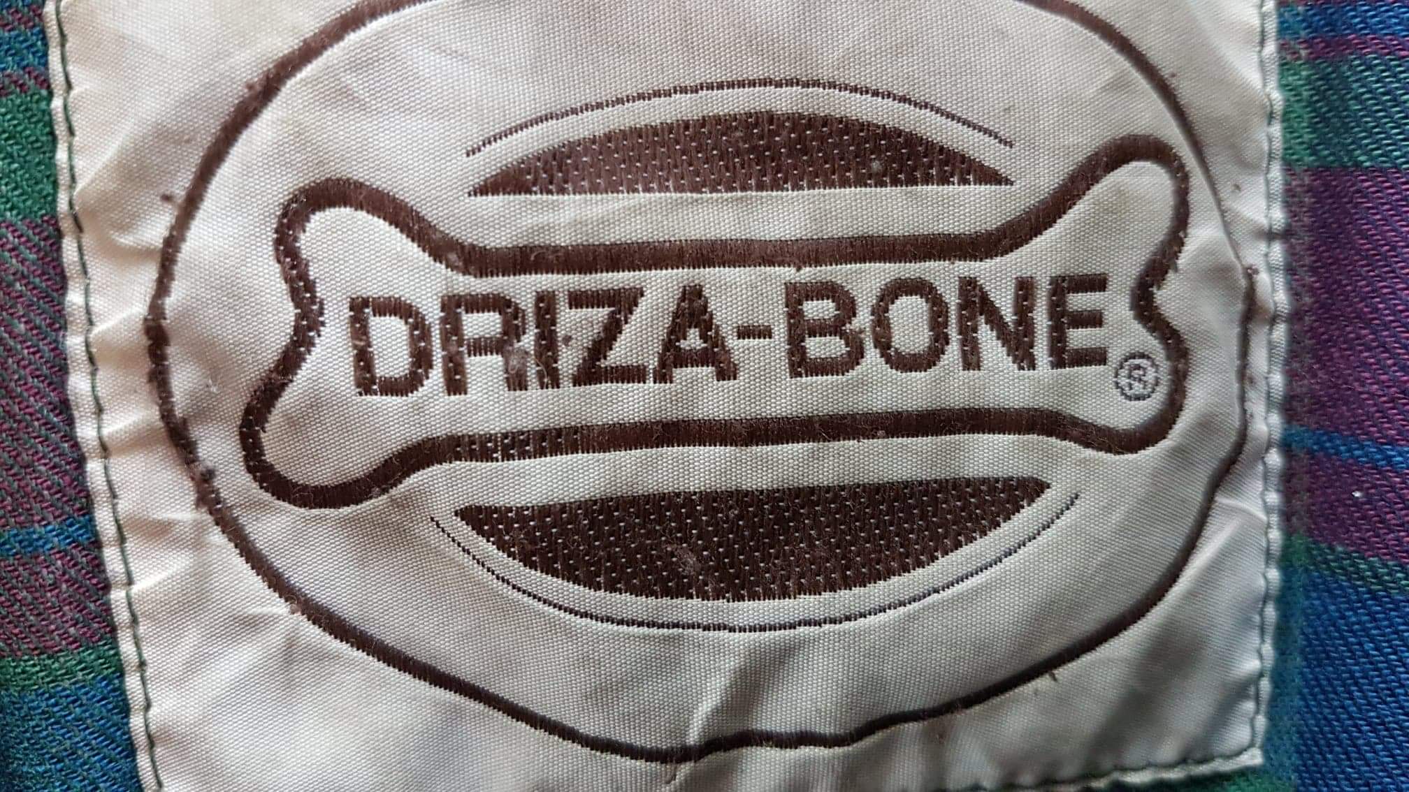 Driza-Bone wax coat label photographed on a garment cleaned and restored by Wax Jackets Cleaned