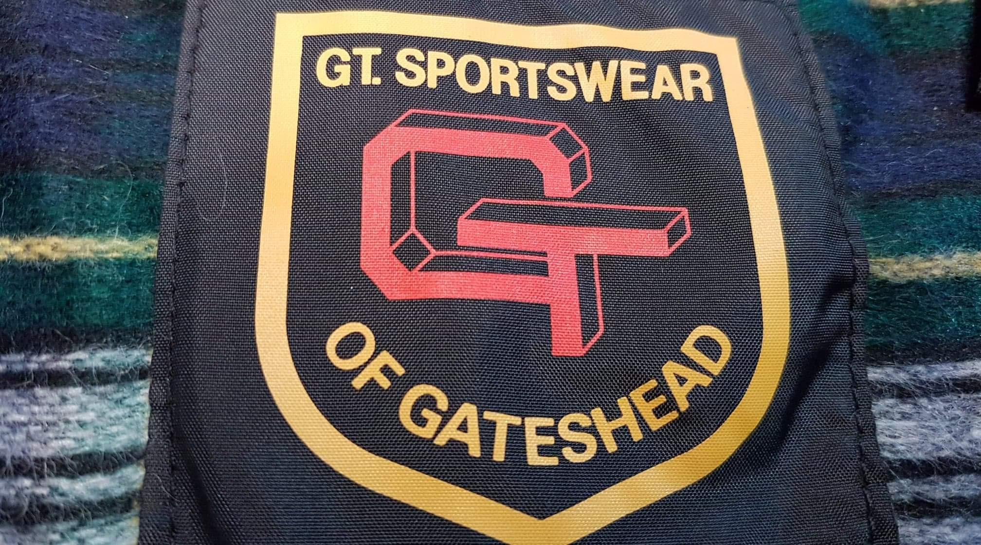 GT Sportswear of Gateshead jacket label photographed by Wax Jackets Cleaned