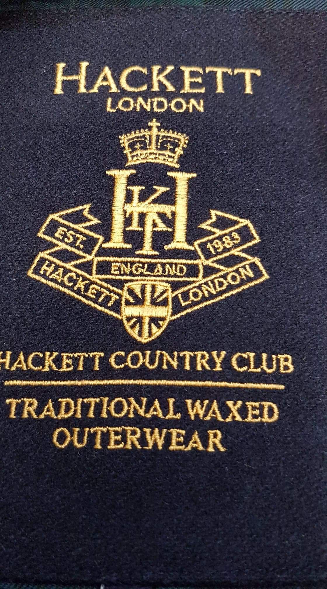 Hackett London traditional waxed outerwear label photographed by Wax Jackets Cleaned