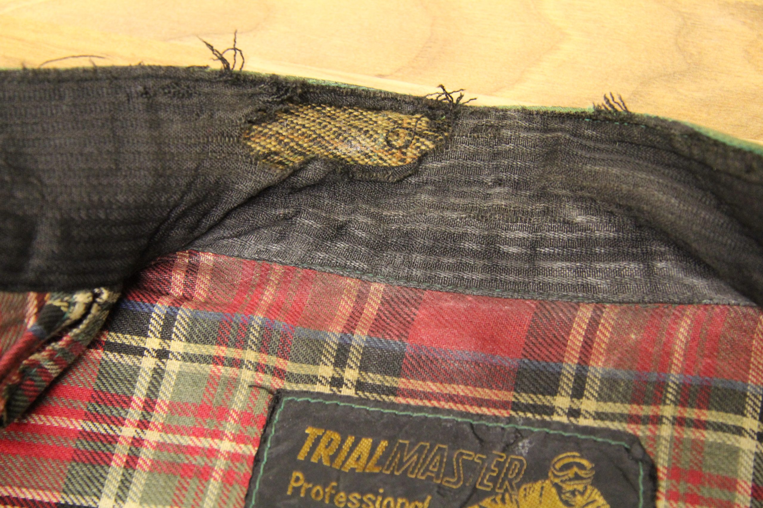 Worn and torn Belstaff collar before restoration